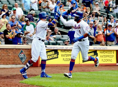 May 20, 2018; New York City, NY, USA; New York Mets shortstop Amed Rosario (1) is congratulated by left fielder Brandon Nimmo (9) after hitting a solo home run against the Arizona Diamondbacks during the sixth inning USA TODAY Sports