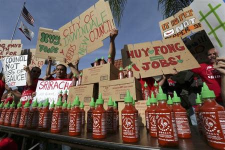 Supporters of Sriracha hot sauce attend a rally at Irwindale City Hall, in Irwindale, California April 23, 2014. REUTERS/Jonathan Alcorn