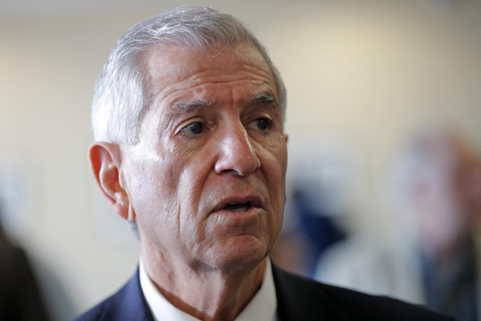 Louisiana's Republican gubernatorial candidate Eddie Rispone greets supporters and talks to media on a campaign stop at New Orleans International Airport in Kenner, La., Monday, Nov. 4, 2019. Rispone says a radio ad linking him and President Donald Trump to former Ku Klux Klan leader David Duke is "disgusting." Rispone is blaming Democratic incumbent John Bel Edwards for the advertising by the New Orleans-based Black Organization for Leadership Development. There's no evidence Edwards is connected to the effort. (AP Photo/Gerald Herbert)