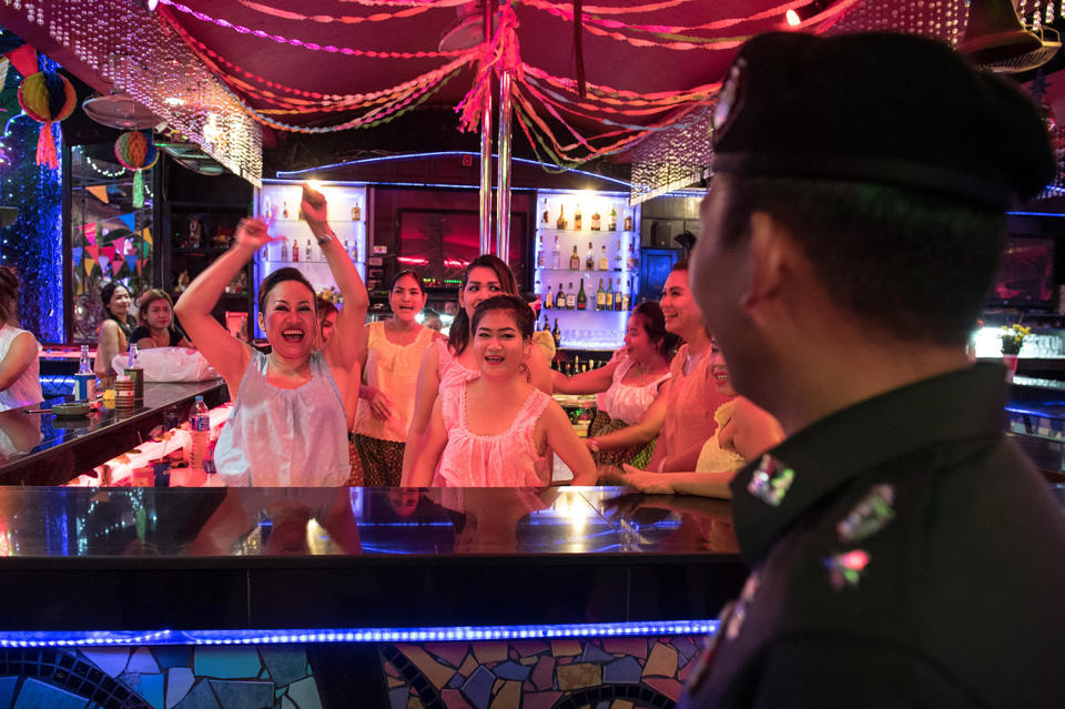 Policeman interacting with bartenders
