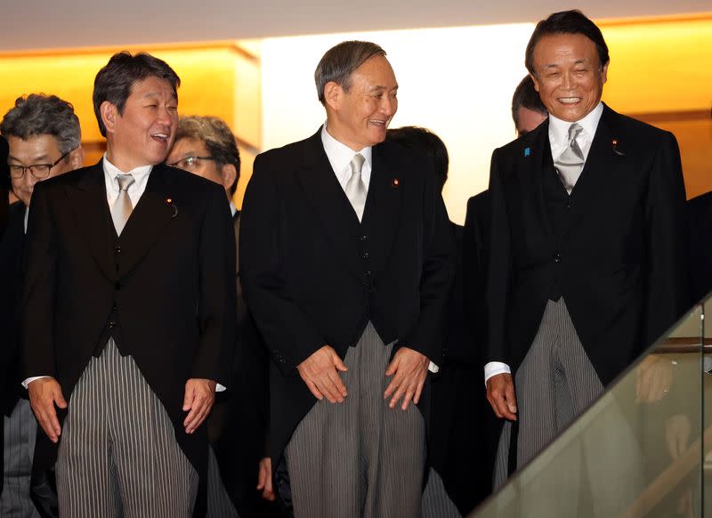Japan's newly appointed PM Suga attends a photo session with his cabinet members in Tokyo