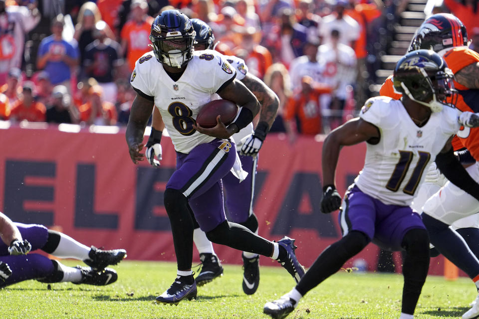 Baltimore Ravens quarterback Lamar Jackson (8) runs the ball against the Denver Broncos in the first half of an NFL football game Sunday, Oct. 3, 2021, in Denver. (AP Photo/Bart Young)