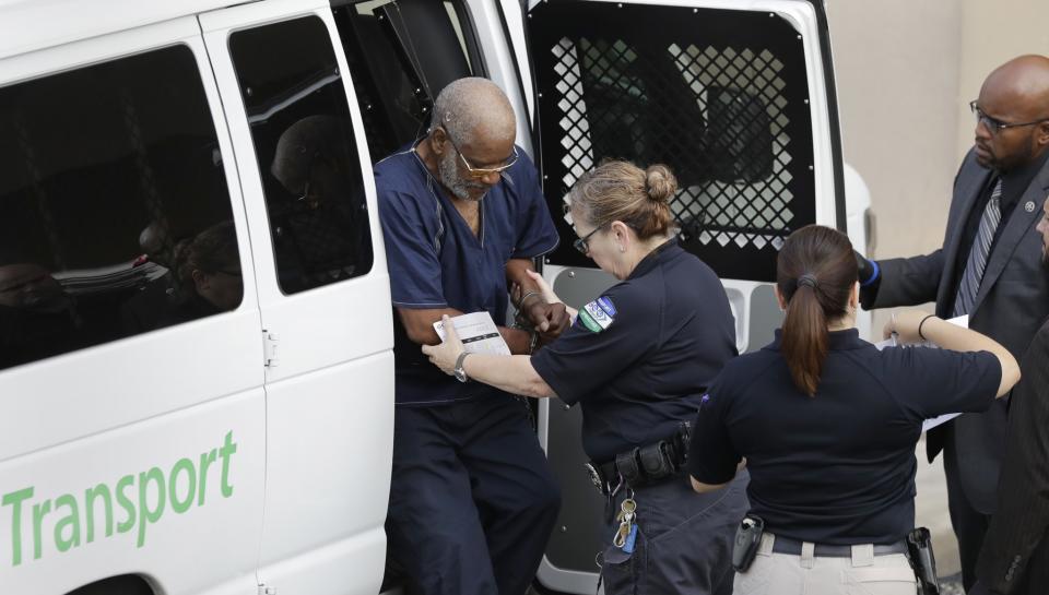 <p>James Mathew Bradley Jr., 60, of Clearwater, Fla., left, arrives at the federal courthouse for a hearing, Monday, July 24, 2017, in San Antonio. Bradley was taken into custody and is expected to be charged in connection to the people who died after being crammed into a sweltering tractor-trailer found parked outside a Walmart in the midsummer Texas heat Sunday, according to authorities in what they described as an immigrant-smuggling attempt gone wrong. (AP Photo/Eric Gay) </p>