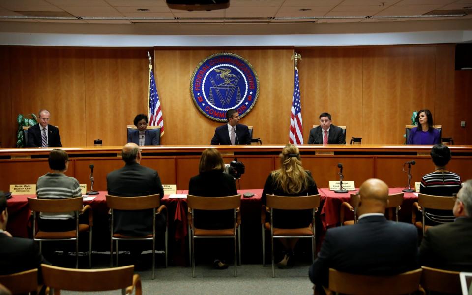 The FCC, led by chairman Ajit Pai, voted 3-to-2 to sweep aside the rules - REUTERS