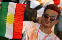 <p>An Iraqi Kurd holds a Kurdish flag during an event to urge people to vote in the upcoming independence referendum in Arbil, the capital of the autonomous Kurdish region of northern Iraq, Sept. 15, 2017. (Photo: Safin Hamed/AFP/Getty Images) </p>