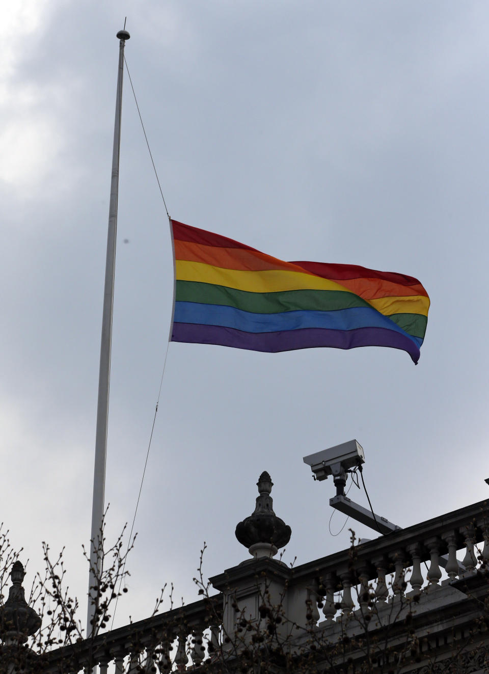 The rainbow flag, a symbol of the lesbian, gay, bisexual, and transgender community, flies over the British government Cabinet Office's building in central London, Friday, March 28, 2014, to mark the start of same-sex weddings in the UK from Saturday March 29, 2014. The British government has ordered rainbow flags flown over two prominent government buildings to mark the country’s first same-sex weddings, ahead of the law taking effect on Saturday. It marks a profound shift in attitudes in a country that little more than a decade ago had a law on the books banning the "promotion" of homosexuality. (AP Photo/Lefteris Pitarakis)