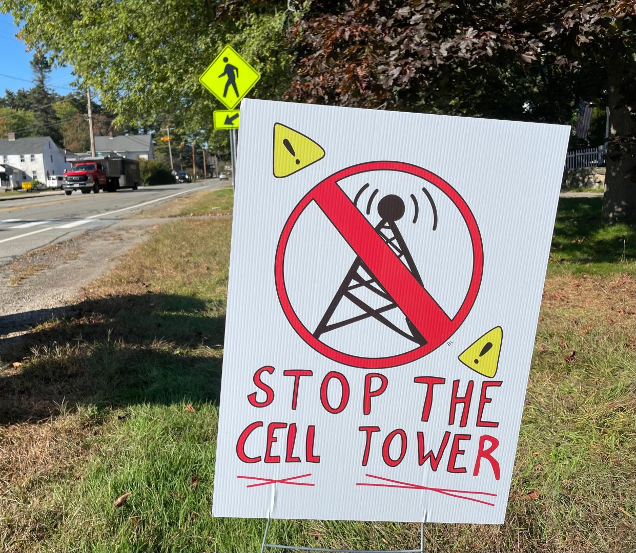 Residents in Hampton, New Hampshire, installed signs to oppose new cell towers, the installation of which has drawn pushback in communities from Los Angeles County to Tucson to Delaware. But local governments have no power to stop companies like Verizon from erecting the internet facilities.