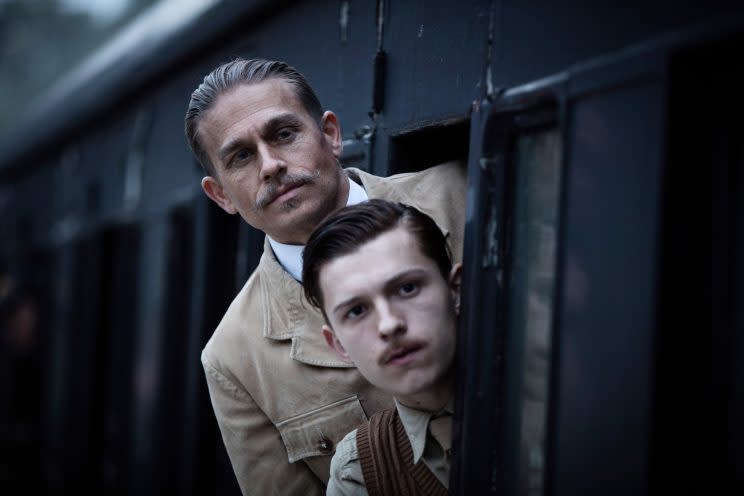 Charlie Hunnam and Tom Holland in dueling mustaches.