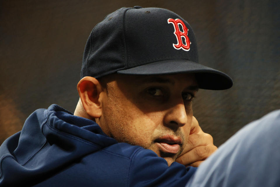 ST PETERSBURG, FLORIDA - OCTOBER 07: Manager Alex Cora #13 of the Boston Red Sox looks on during batting practice prior to Game 1 of the American League Division Series against the Tampa Bay Rays at Tropicana Field on October 07, 2021 in St Petersburg, Florida. (Photo by Mike Ehrmann/Getty Images)