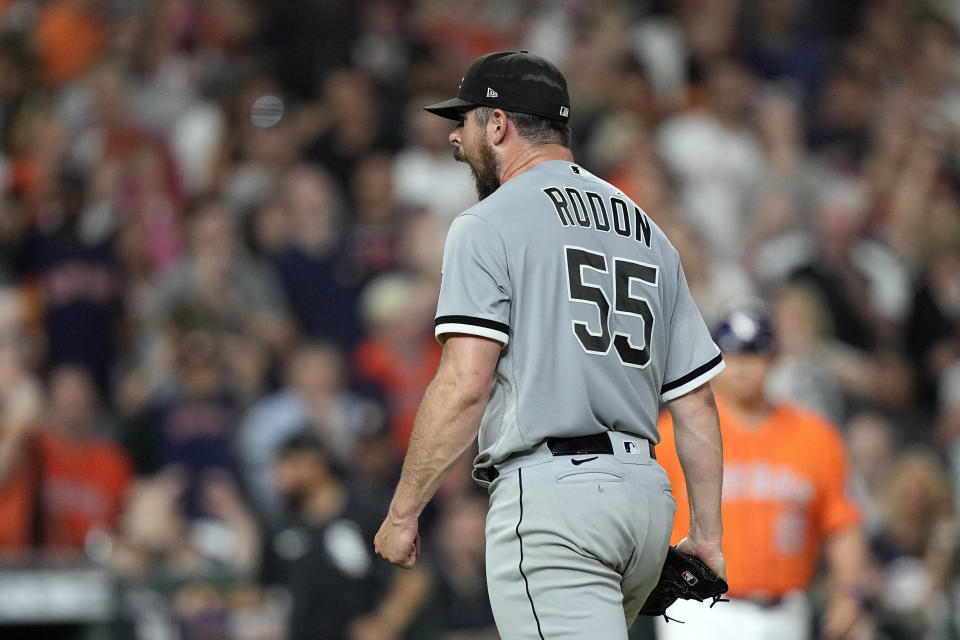 Chicago White Sox starting pitcher Carlos Rodon (55) yells after striking out Houston Astros' Jose Altuve with the bases loaded to end the fifth inning of a baseball game Friday, June 18, 2021, in Houston. (AP Photo/David J. Phillip)