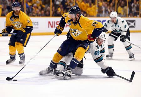 Nashville Predators defenseman Mattias Ekholm (14) skates against San Jose Sharks right wing Melker Karlsson (68) during the overtime period in game four of the second round of the 2016 Stanley Cup Playoffs at Bridgestone Arena. Mandatory Credit: Aaron Doster-USA TODAY Sports