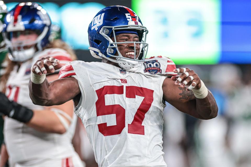 Aug 24, 2024; East Rutherford, New Jersey, USA; New York Giants linebacker K.J. Cloyd celebrates after a defensive stop against the New York Jets during the second half at MetLife Stadium. Mandatory Credit: Vincent Carchietta-USA TODAY Sports