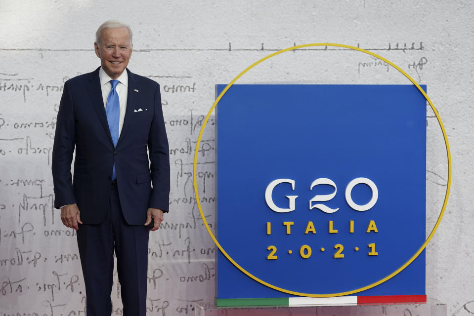 U.S. President Joe Biden poses for a photograph as he arrives at the La Nuvola conference center for the G20 summit in Rome, Saturday, Oct. 30, 2021. The two-day Group of 20 summit is the first in-person gathering of leaders of the world's biggest economies since the COVID-19 pandemic started. (Kevin Lamarque/Pool Photo via AP)