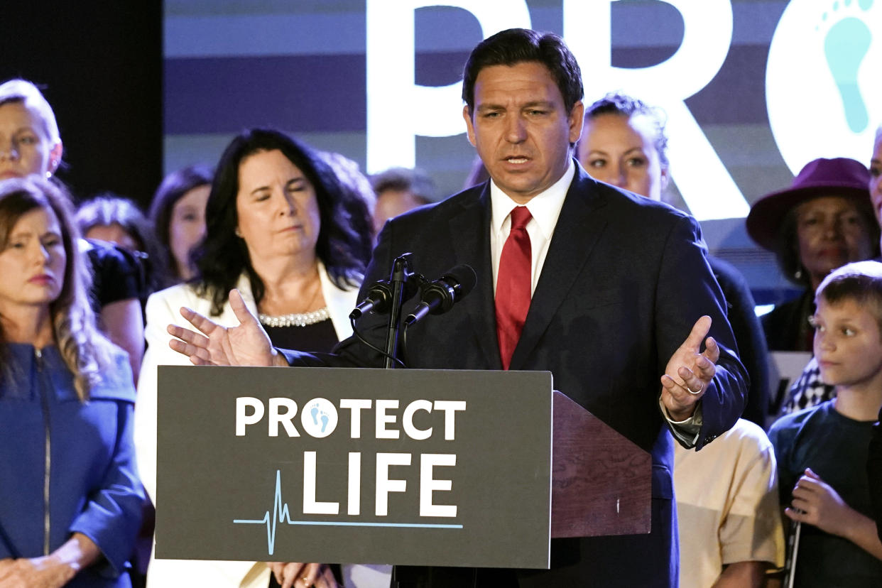 FILE - Florida Gov. Ron DeSantis speaks to supporters before signing a 15-week abortion ban into law Thursday, April 14, 2022, in Kissimmee, Fla. DeSantis signed into law one of the nation's toughest abortion bans late Thursday, April 11, 2023. If the courts ultimately allow the new measure to take effect, it will soon be illegal for Florida women to obtain an abortion after six weeks of pregnancy, which is before most realize they're pregnant. (AP Photo/John Raoux, File)