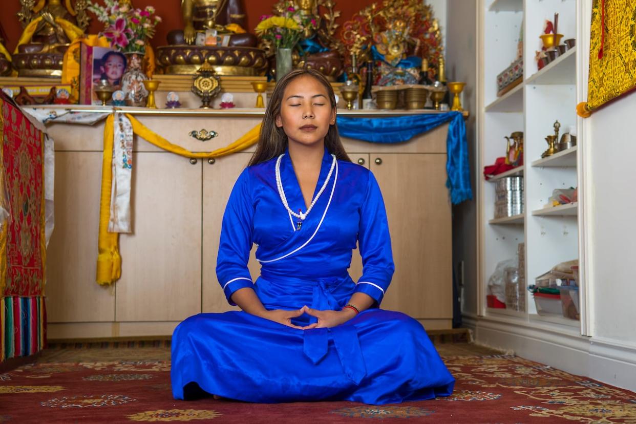 Chemi Lhamo is a member of the Buddhist community. She says various places of worship have had to start screening new guests more thoroughly because of a recent string of break-ins across the Greater Toronto Area.  (Enviro Foto - image credit)