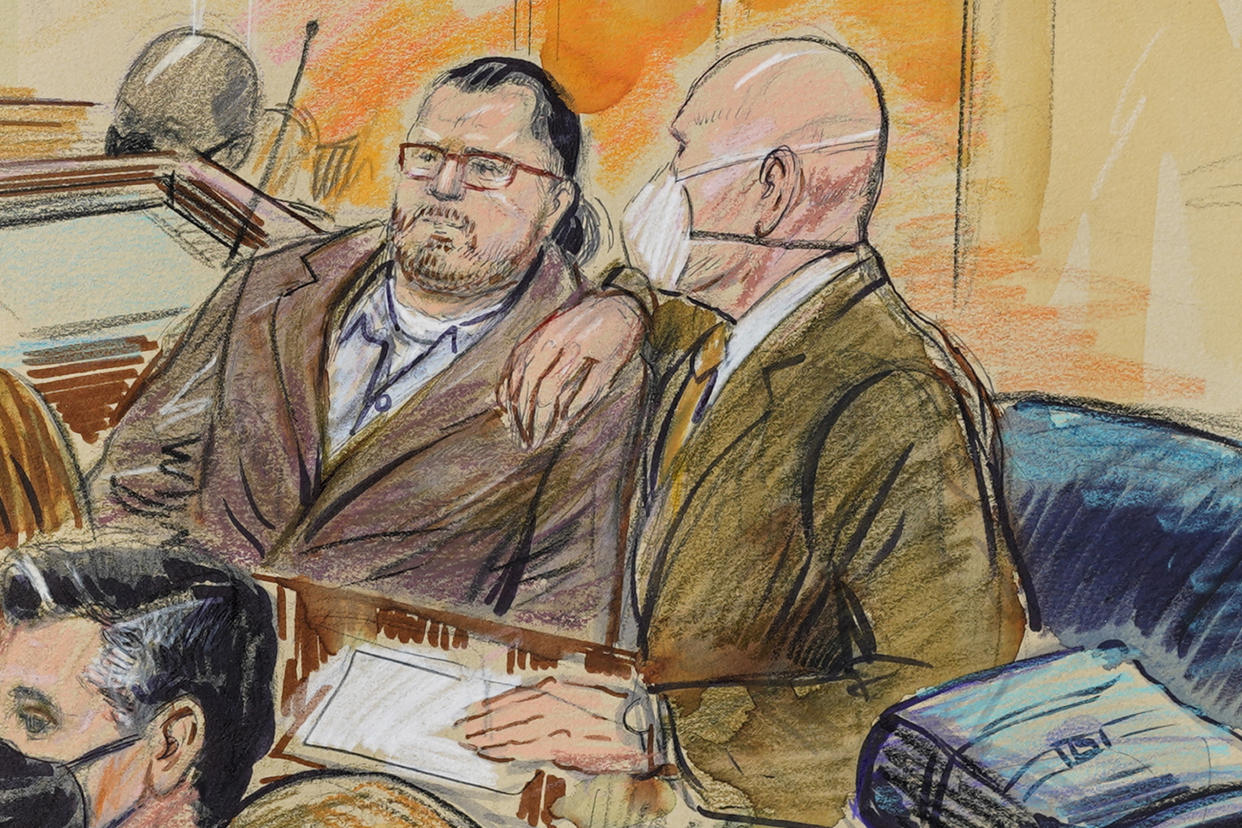 Artist sketch depicts Guy Reffitt, joined by his lawyer William Welch, right, in federal court in Washington, D.C., on Feb. 28, 2022. 