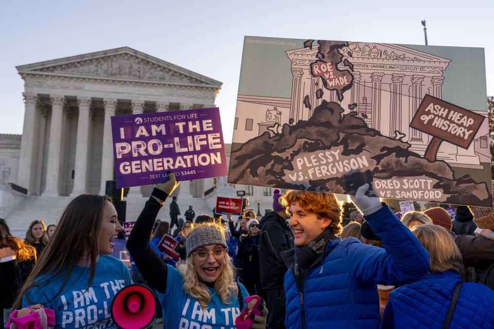 Anti-abortion protesters wear shirts that read "I am the Pro-Life Generation" as they demonstrate in front of the U.S. Supreme Court, Wednesday, Dec. 1, 2021, in Washington, as the court hears arguments in a case from Mississippi, where a 2018 law would ban abortions after 15 weeks of pregnancy, well before viability. (AP Photo/Andrew Harnik)
