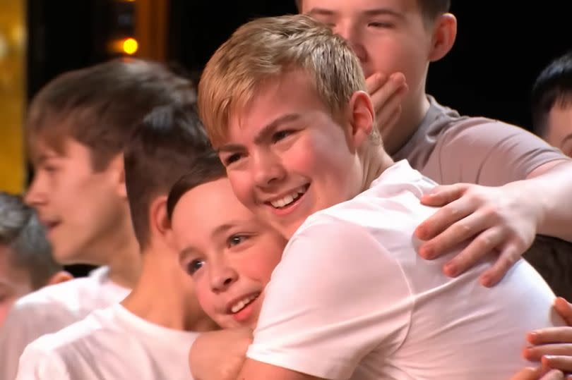 Screenshot of Charlie Cufflin on the right hugging a fellow dancer after Golden Buzzer