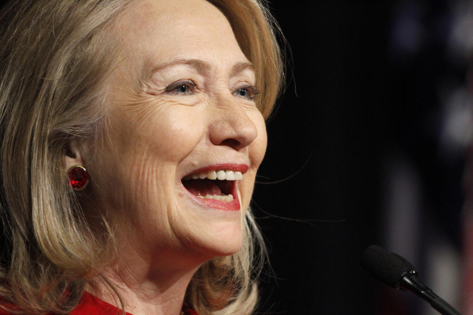 Former Secretary of State Hillary Rodham Clinton laughs as she gives a speech during a ceremony honoring her at the Pentagon, Thursday, Feb. 14, 2013, where outgoing Defense Secretary Leon Panetta presented her with the Defense Department's Medal for Distinguished Public Service. 