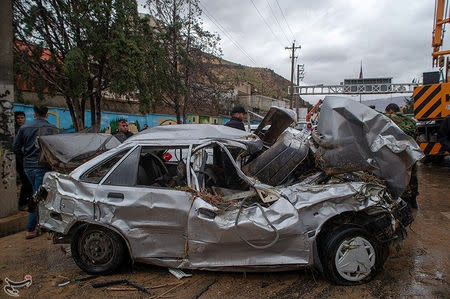 Damaged vehicles are seen after a flash flooding In Shiraz, Iran, March 25, 2019. Tasnim News Agency/Handout via REUTERS