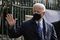 President Joe Biden waves as he departs after attending Mass at Holy Trinity Catholic Church, Sunday, Jan. 24, 2021, in the Georgetown neighborhood of Washington. (AP Photo/Patrick Semansky)