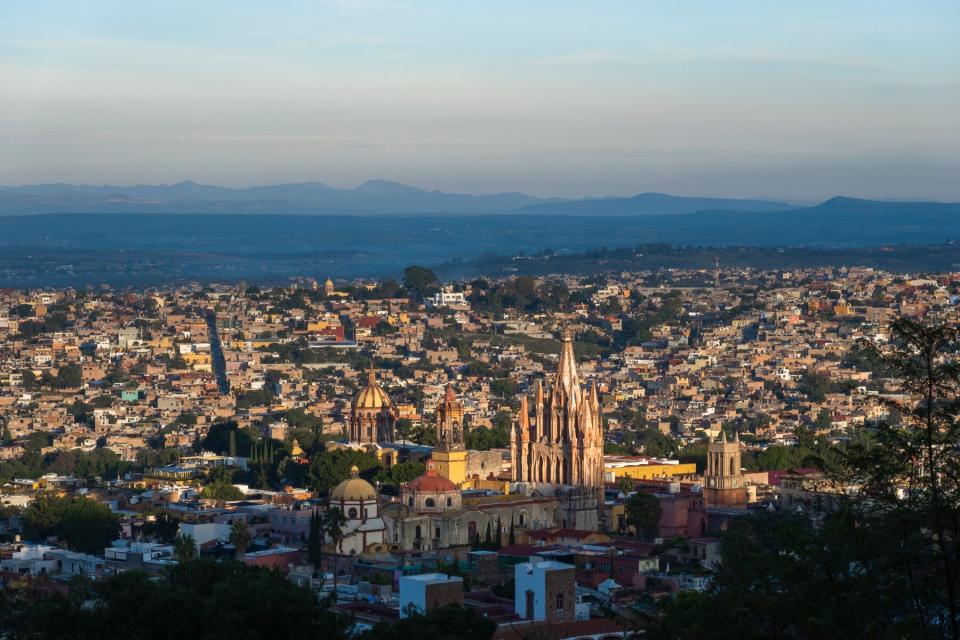 Panoramic view of San Miguel de Allende with the cathedral in the background at sunrise, Mexico