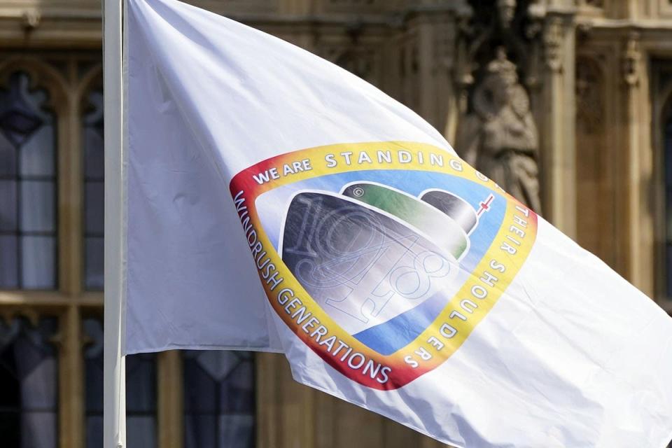 The Windrush flag was flown outside Parliament on the 75th anniversary of the ship’s arrival to Britain, but campaigners said compensation for victims of the scandal has been far too slowly paid out (Aaron Chown/PA) (PA Archive)