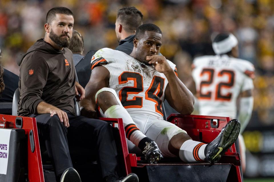 Cleveland Browns running back Nick Chubb (24) is carted off the field after being injured during an NFL football game, Monday, Sept. 18, 2023, in Pittsburgh. (AP Photo/Matt Durisko)