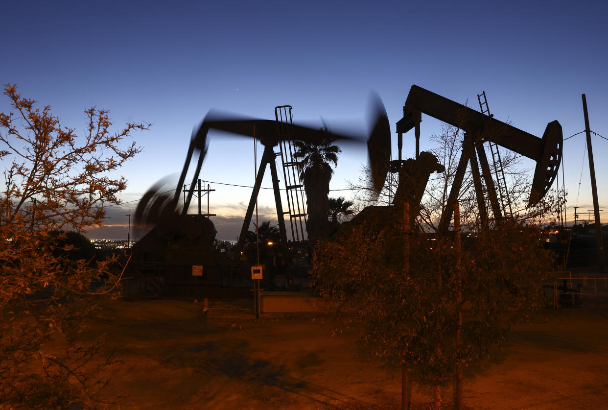 oil prices LOS ANGELES, CALIFORNIA - JANUARY 28:  An oil pumpjack (C) operates as another (R) stands idle in the Inglewood Oil Field on January 28, 2022 in Los Angeles, California. The Los Angeles City Council voted to ban new oil and gas drilling as well as evaluating how to decommission existing wells in the city following years of complaints from residents. Thousands of Angelenos reside in close proximity to the more than 5,200 gas and oil wells in the city and many have complained about negative health consequences. (Photo by Mario Tama/Getty Images)