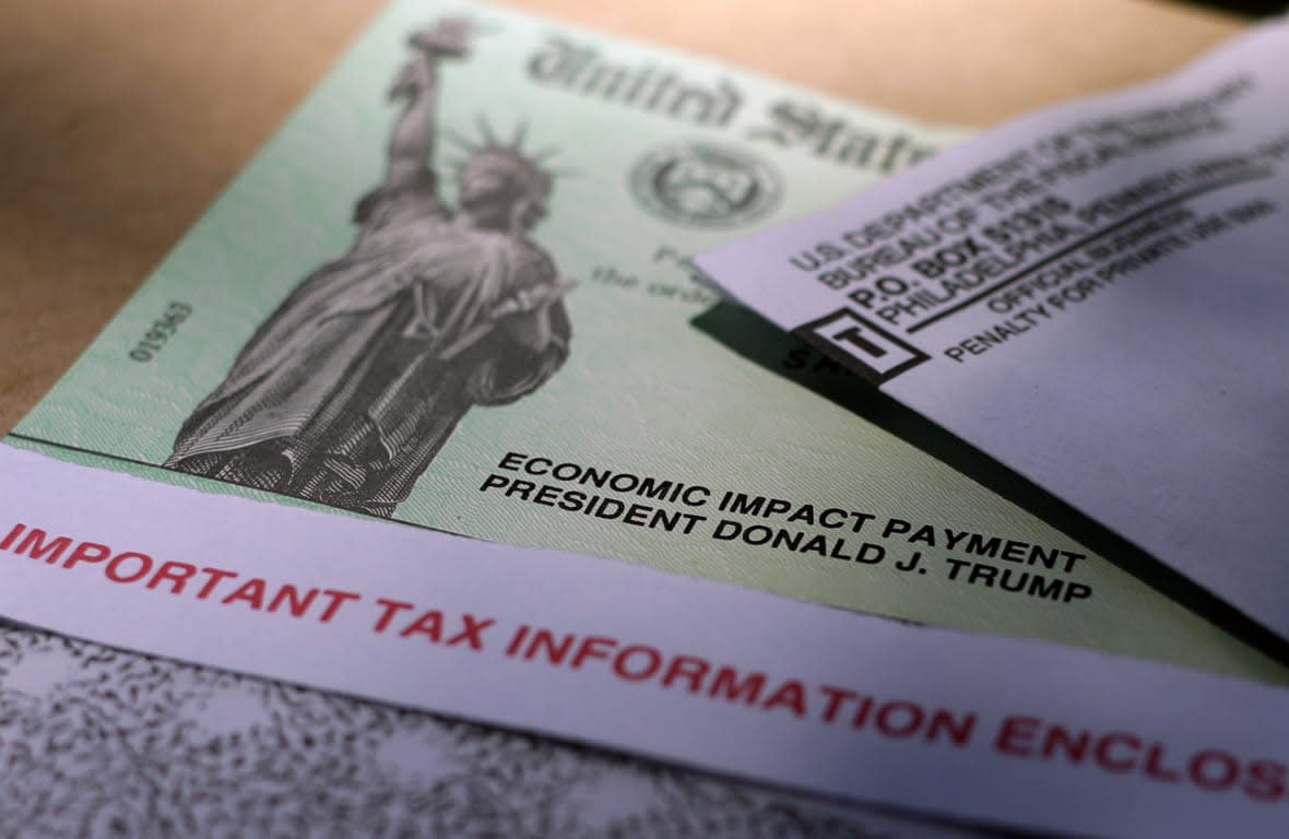 FILE – President Donald J. Trump’s name is printed on a stimulus check issued by the IRS to help combat the adverse economic effects of the COVID-19 outbreak in this April 23, 2020 photo taken in San Antonio. Early in the pandemic, government relief checks became an attractive target for criminals. The problem has only gotten worse and postal authorities and bank officials are warning Americans to avoid mailing checks if possible, or at least to use a secure mail drop such as inside the post office. (AP Photo/Eric Gay, File)