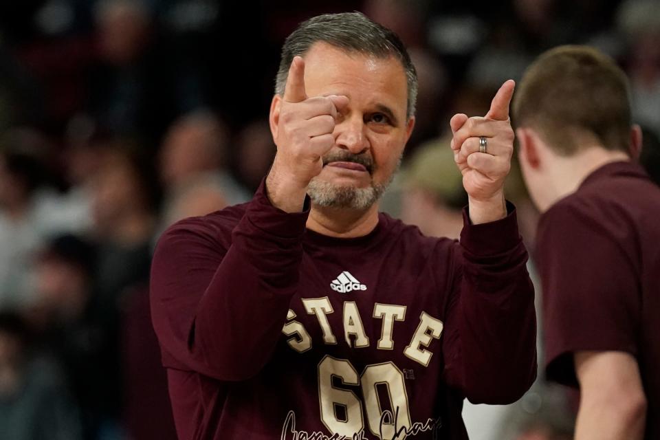 Mississippi State head coach Chris Jans salutes students and fans following the team's win over TCU in an NCAA college basketball game in Starkville, Miss., Saturday, Jan. 28, 2023. (AP Photo/Rogelio V. Solis)