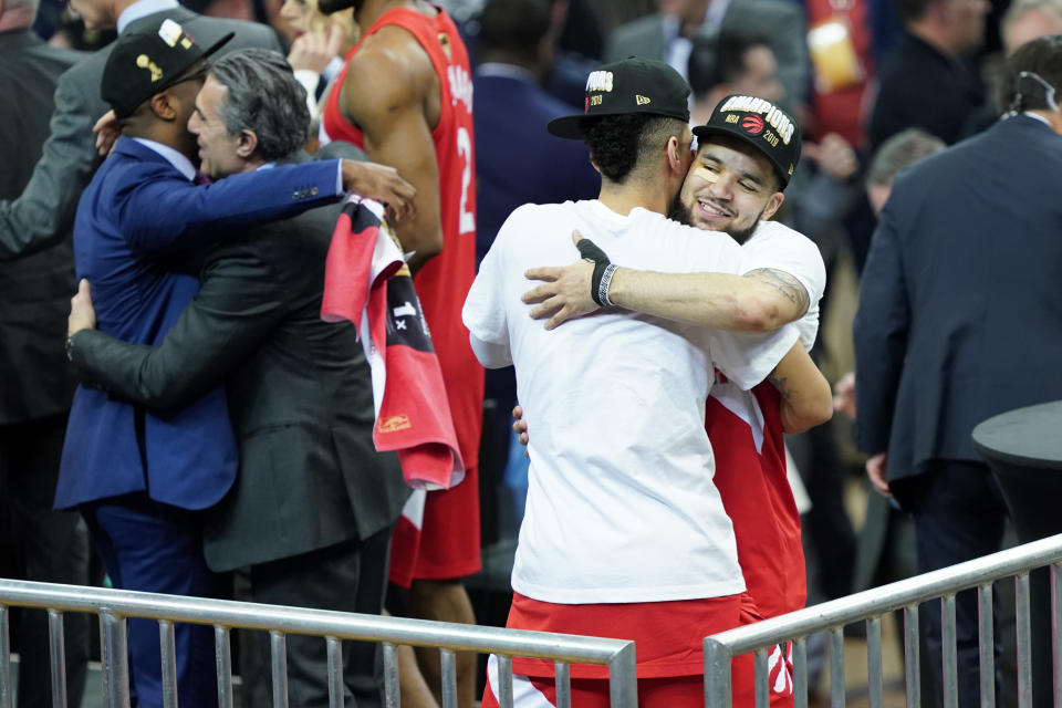 OAKLAND, CALIFORNIA - JUNE 13: Fred VanVleet #23 and Danny Green #14 of the Toronto Raptors celebrate their teams victory over the Golden State Warriors to win Game Six of the 2019 NBA Finals at ORACLE Arena on June 13, 2019 in Oakland, California. NOTE TO USER: User expressly acknowledges and agrees that, by downloading and or using this photograph, User is consenting to the terms and conditions of the Getty Images License Agreement. (Photo by Thearon W. Henderson/Getty Images)