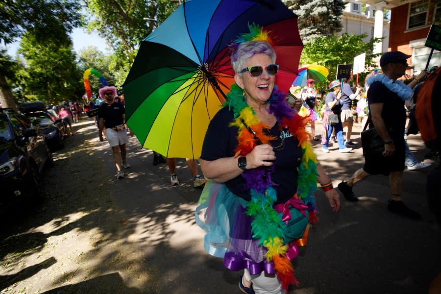 Participants take part in the Pride parade through the streets of downtown Sunday, June 25, 2023, in Denver. (AP Photo/David Zalubowski)