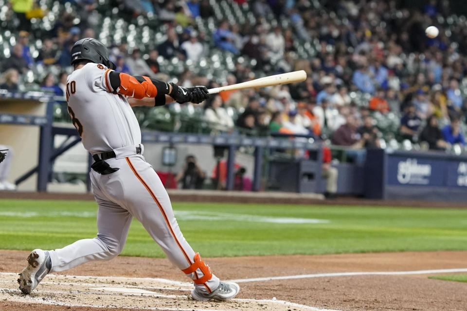 San Francisco Giants' Michael Conforto hits a single during the fourth inning of a baseball game against the Milwaukee Brewers Thursday, May 25, 2023, in Milwaukee. (AP Photo/Morry Gash)