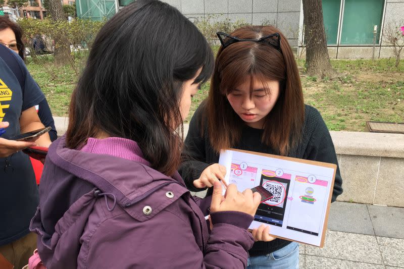 People attend an event organised by Taiwanese NGO Fake News Cleaner on how to spot and report suspected fake news, in New Taipei City