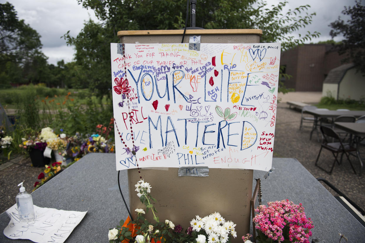 A sign reading "Your Life Mattered" hangs on a podium outside J.J. Hill Montessori School on July 14, 2016, in Saint Paul, Minnesota. (Photo: Stephen Maturen via Getty Images)
