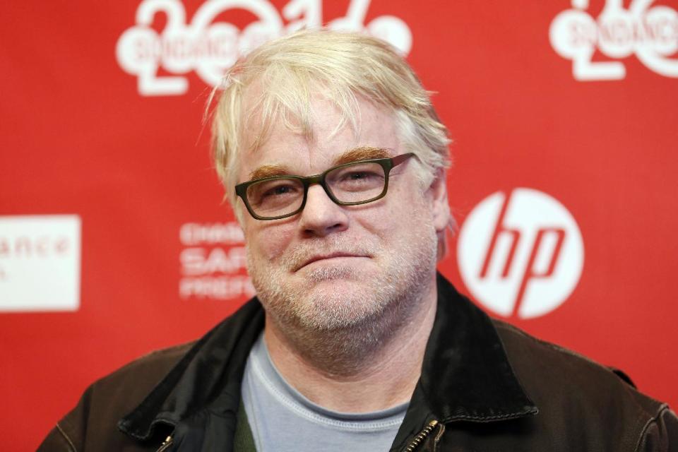 FILE - In this Sunday, Jan. 19, 2014 file photo, cast member Philip Seymour Hoffman poses at the premiere of the film "A Most Wanted Man" during the 2014 Sundance Film Festival, in Park City, Utah. Hoffman's new movie is a psychological thriller about terrorism, but he says it also has something to do with hitting a midlife crisis, and that's what really drew him to the role. He plays a German operative heading up an anti-terrorism team in Hamburg, Germany. (Photo by Danny Moloshok/Invision/AP, File)