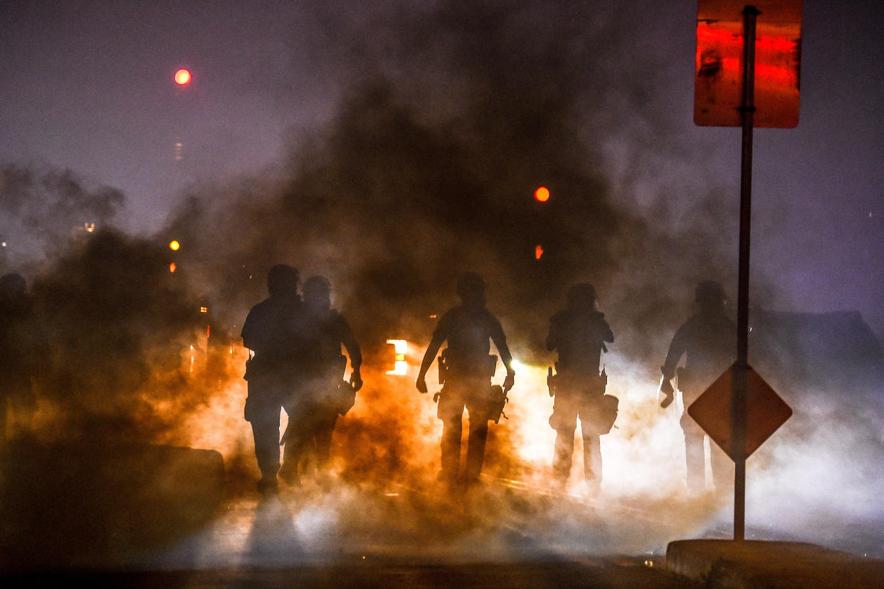 Police use tear gas to disperse a protest in Minneapolis on May 29, 2020, over the death of George Floyd. (Chandan Khanna / AFP via Getty Images file)