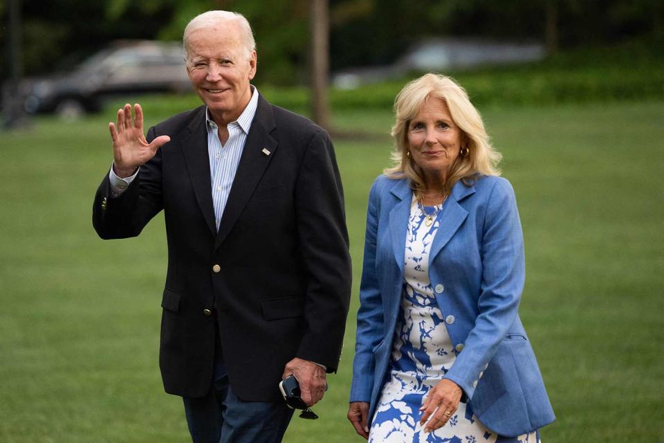 <p>SAUL LOEB/AFP via Getty Images</p> U.S. President Joe Biden and First Lady Jill Biden are pictured walking to the White House upon arrival on the South Lawn in Washington, DC, August 26, 2023.