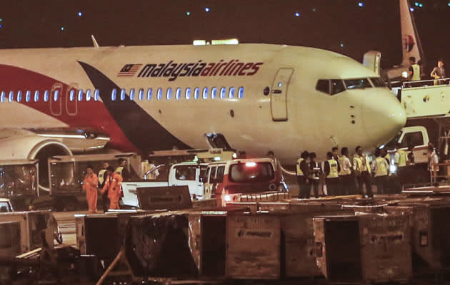 A Malaysia Airlines flight heading to India with 166 people aboard made an emergency landing in Kuala Lumpur early Monday after it was forced to turn back when a tire burst upon takeoff, the airline said. (AP Photo)