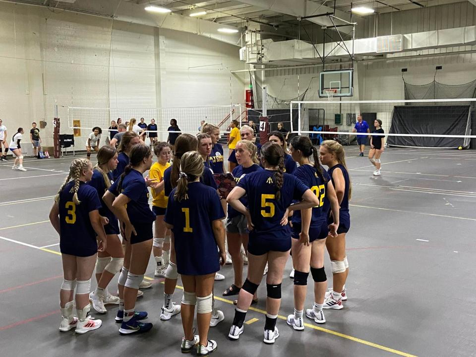 Head coach Brittany Cornish meets with the varsity team during a two-day camp on the campus of Ferris State University in Big Rapids, Mich.
