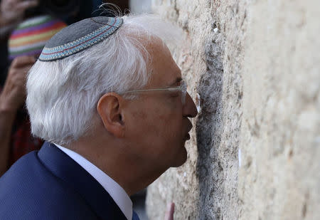 David Friedman, new United States Ambassador to Israel, kisses the Western Wall after arriving in the Jewish state on Monday and immediately paying a visit to the main Jewish holy site, in Jerusalem's Old City May 15, 2017 REUTERS/Ammar Awad