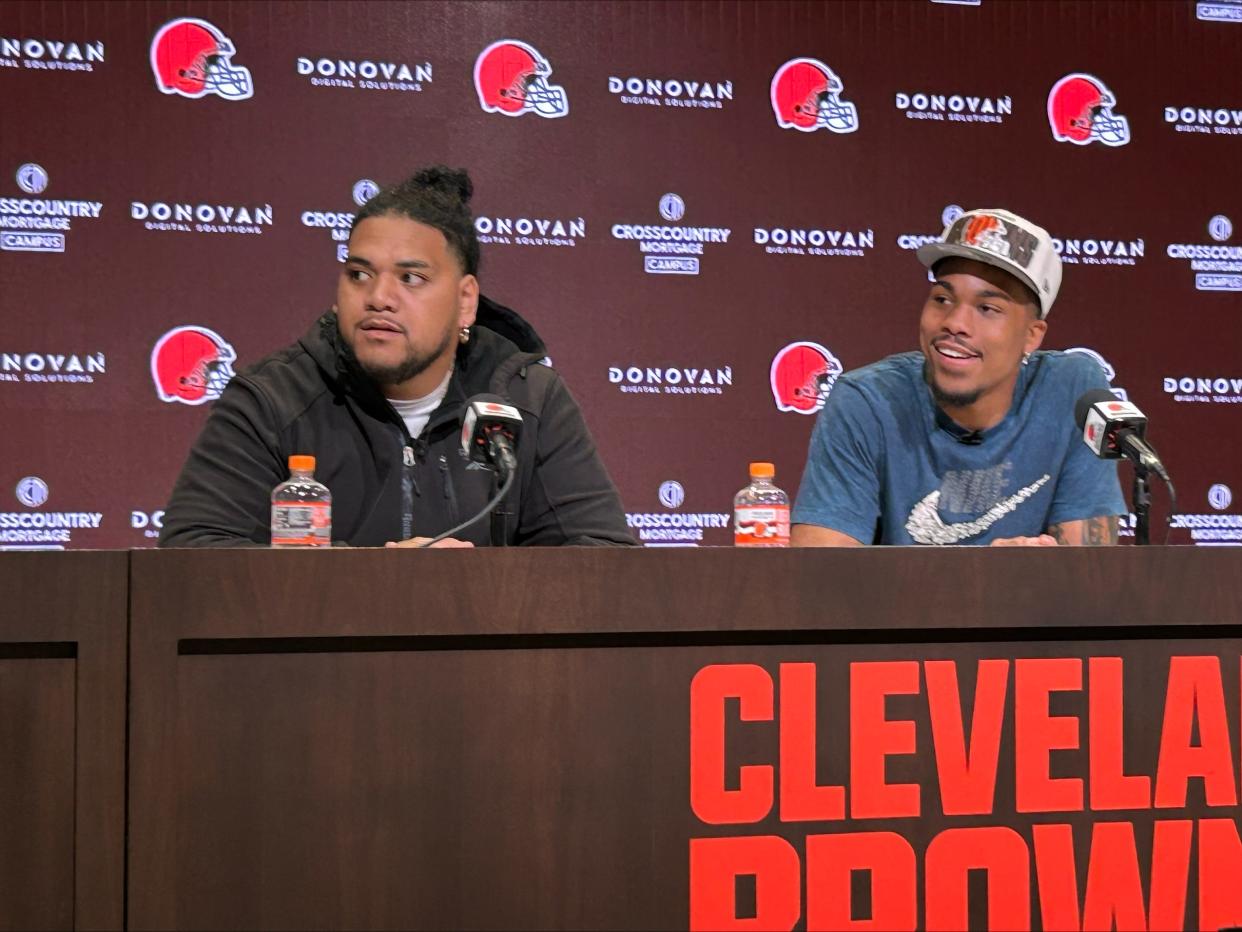 Cleveland Browns third-round draft picks Siaka Ika, left, and Cedric Tillman talk at an introductory press conference on Saturday, April 29, 2023.