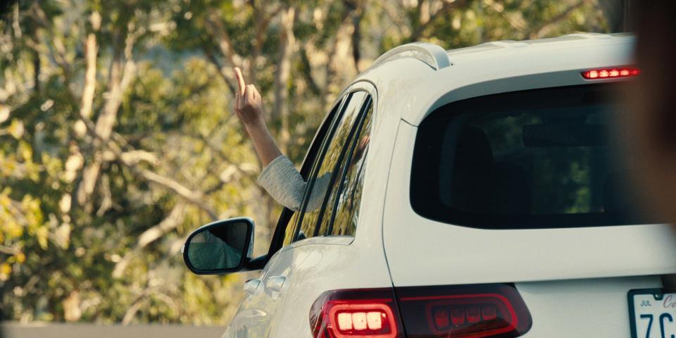 Wong's character Amy gives Danny the finger during a road rage incident that becomes the driving force behind the series. (Netflix)