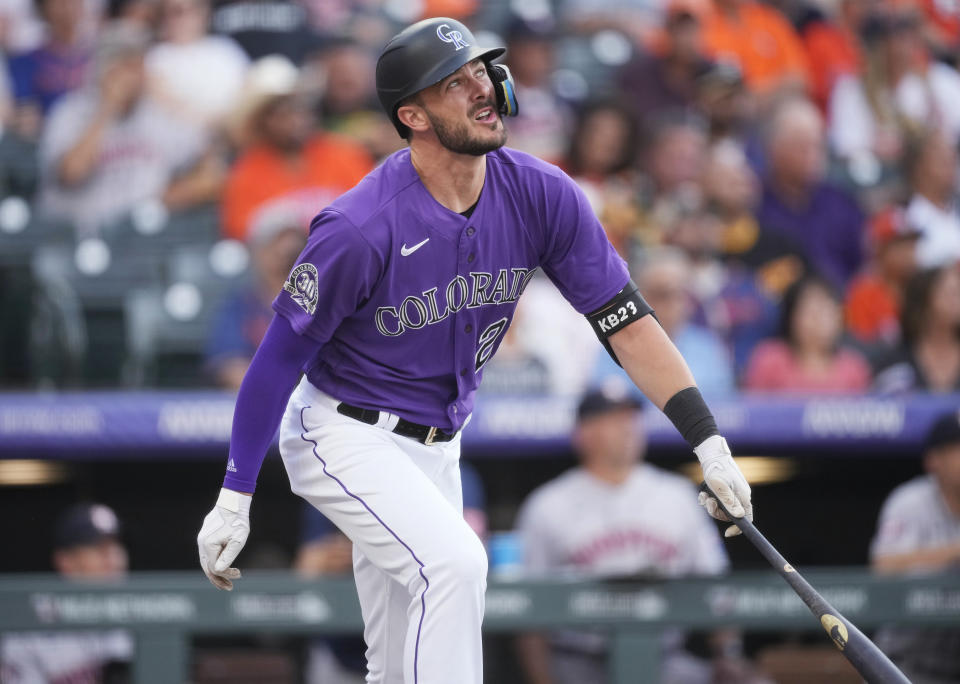 Colorado Rockies' Kris Bryant watches his two-run home run off Houston Astros starting pitcher Hunter Brown during the first inning of a baseball game Tuesday, July 18, 2023, in Denver. (AP Photo/David Zalubowski)