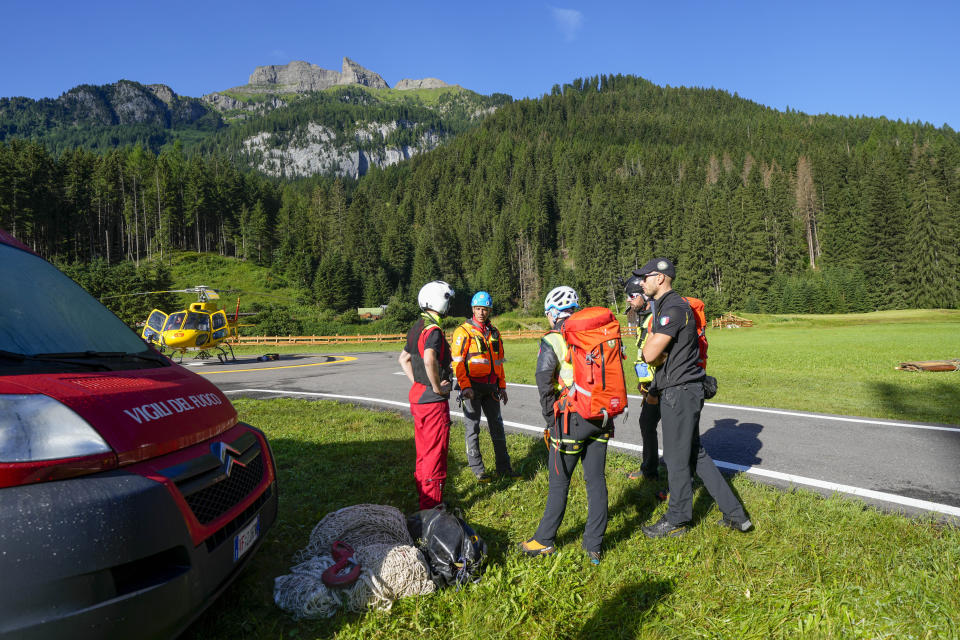 Rescuers prepare to conduct searches for the victims of the Punta Rocca glacier avalanche in Canazei, in the Italian Alps in northern Italy, Tuesday, July 5, 2022, two day after a huge chunk of the glacier broke loose, sending an avalanche of ice, snow, and rocks onto hikers. (AP Photo/Luca Bruno)