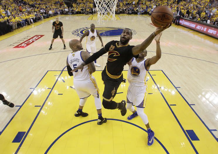 Cleveland Cavaliers forward LeBron James (23) shoots against the Golden State Warriors during the first half of Game 7 of basketball's NBA Finals in Oakland, Calif., Sunday, June 19, 2016. (AP Photo/Marcio Jose Sanchez, Pool)