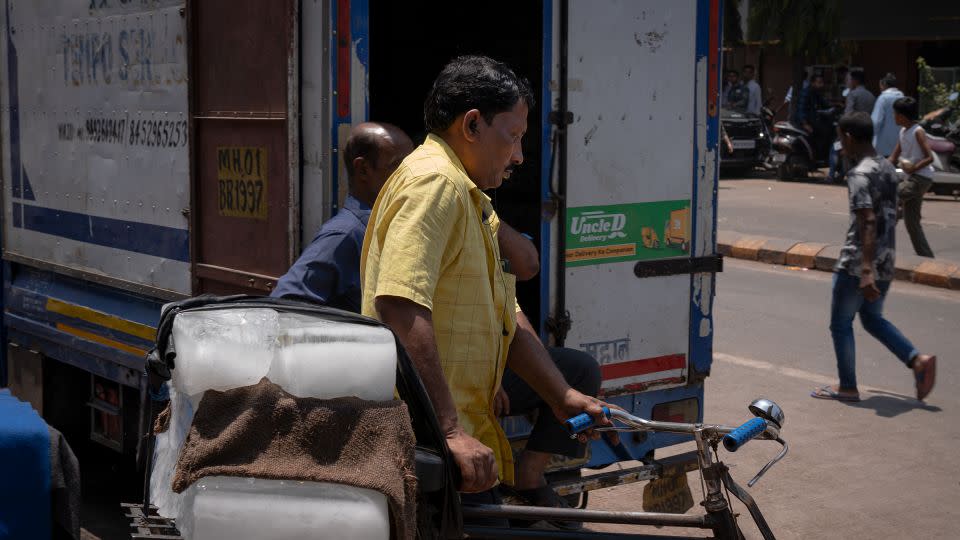 A man carries ice on his bicycle in Mumbai, India on Sunday, April 14, 2024. - Noemi Cassanelli/CNN