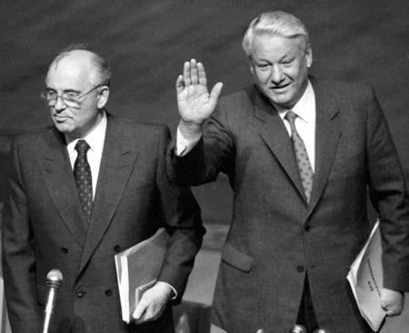 FILE PHOTO -Russian President Boris Yeltsin (R) gestures as he stands with Soviet President Mikhail Gorbachev during the Extraordinary meeting of the Supreme Soviet of Russian Federation in Moscow, August 23, 1991. REUTERS/Alexander Natruskin/File Photo
