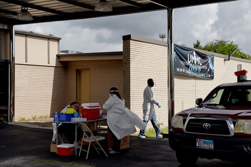 People wait in long lines for COVID-19 testing in Houston